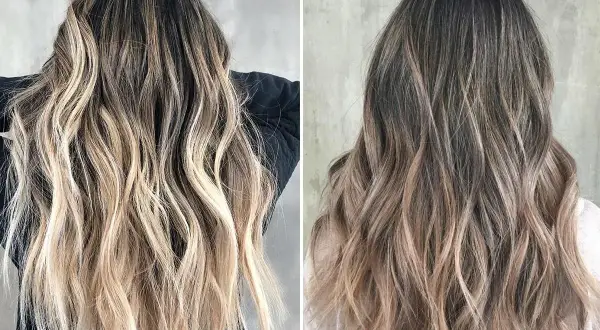Długie, falowane włosy z efektem flamboyage, przechodzące od ciemnego brązu do jasnego blondu.