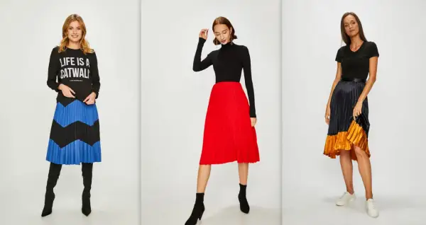 Trzy kobiety prezentują modne stylizacje z plisowanymi spódnicami. Jedna w czarnej bluzie z napisem "LIFE IS A CATWALK" i spódnicy w niebiesko-czarne pasy. Druga w czarnym golfie i czerwonej spódnicy. Trzecia w czarnej bluzce i spódnicy w odcieniach gr...